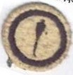 Picture of round white felt badge with logo of a Cobbler's Awl in dark blue embroidery in a ring of dark blue embroidery.
