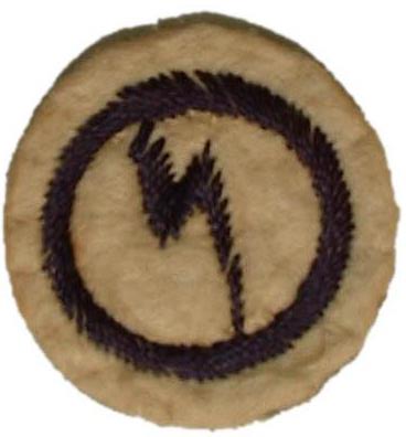 Guide Electrician Badge with logo of lightning bolt in ring, stitched in dark blue thread on white felt.